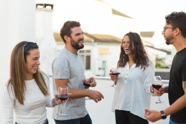 happy-cheerful-people-having-fun-drinking-wine_74855-2842
